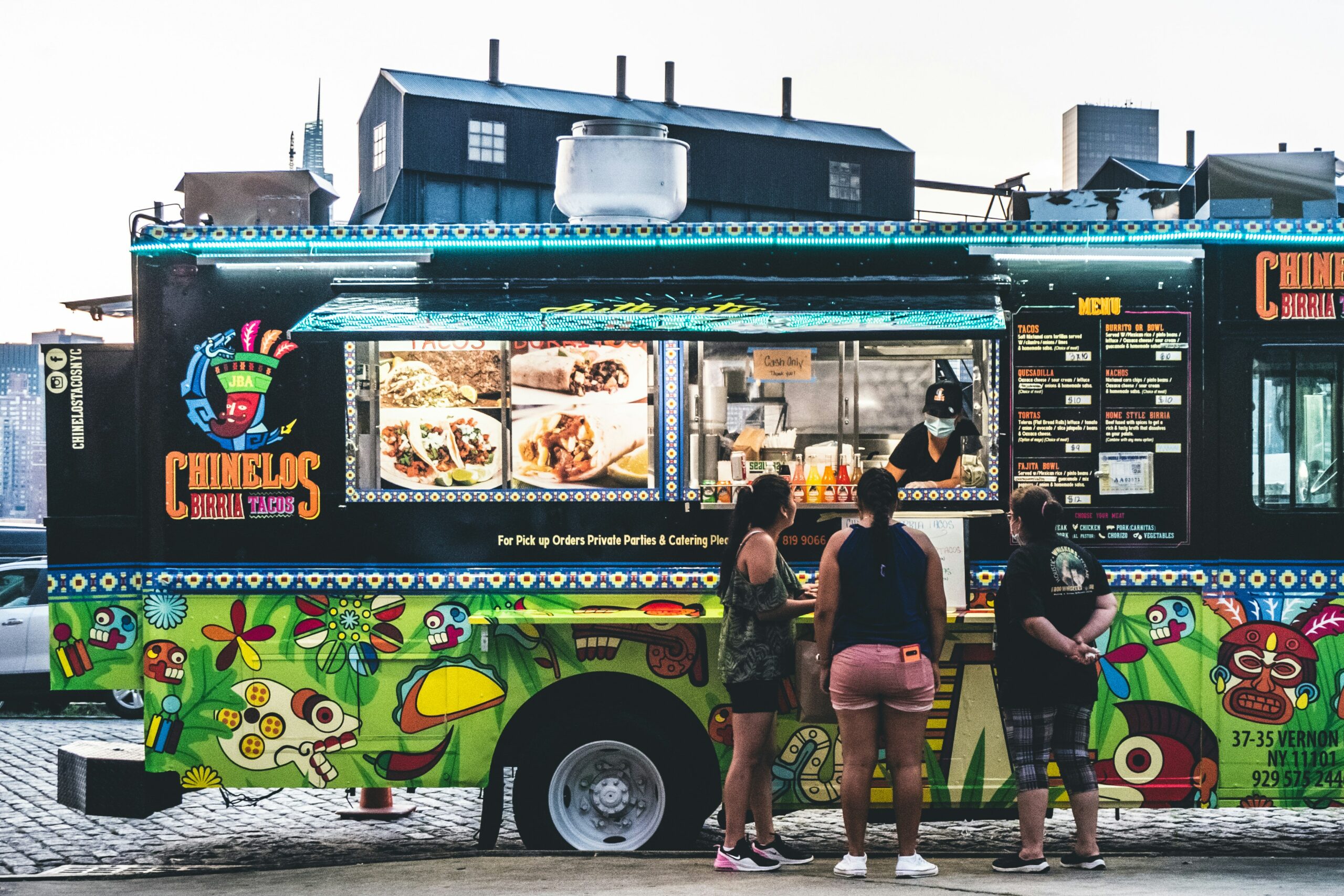 People queueing outside a food truck.